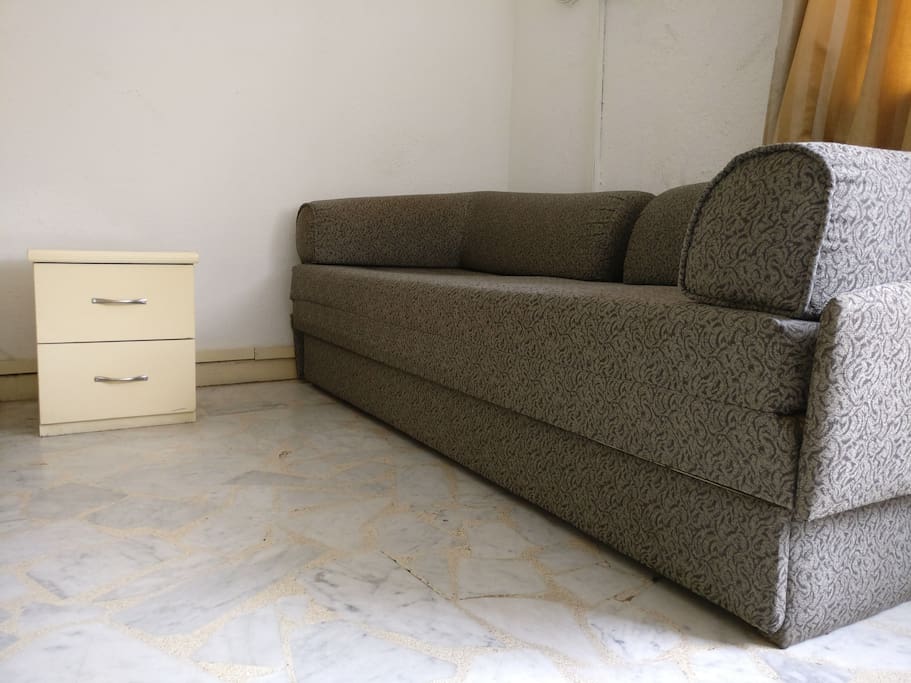 A sofa cum bed for the third guest