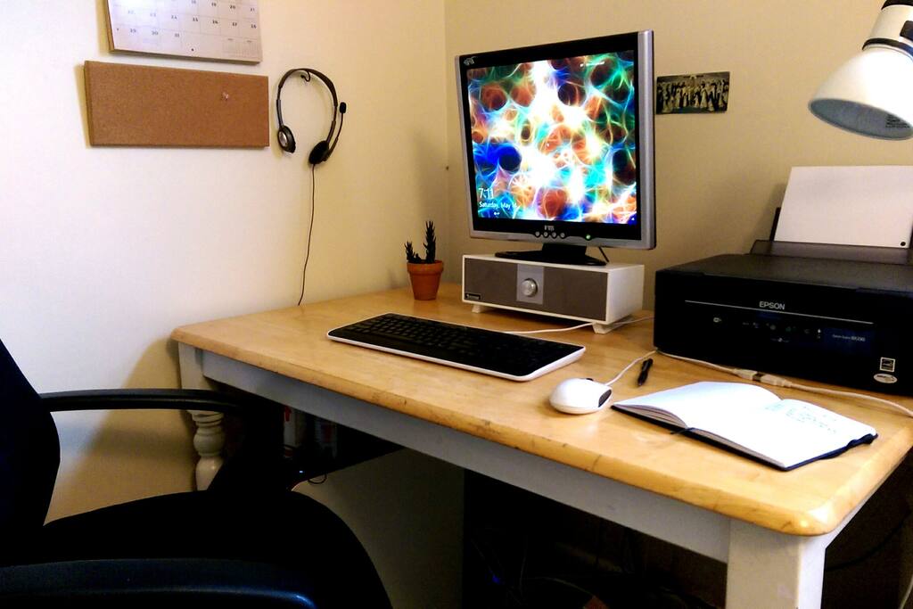 Desk space with computer and printer for guest use.