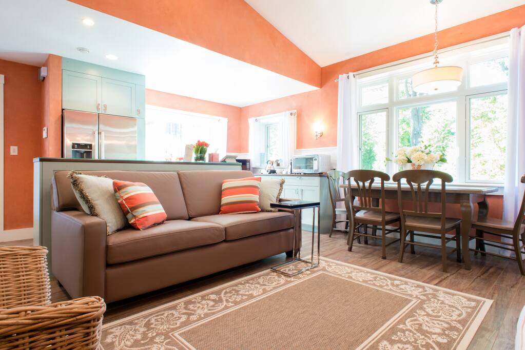 The centerpiece of Hummingbird Cottage is a cathedral-ceiling living room/kitchen/dining area.