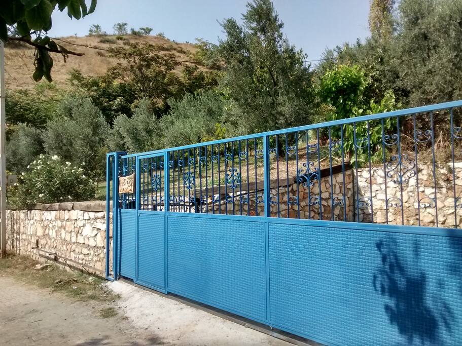 Gate at entrance to garden and a car-parking space for two cars