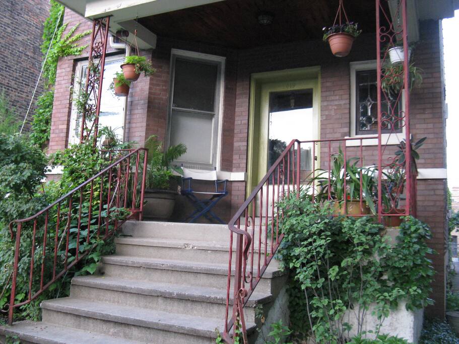 There's a lot of green at this house, including the front door, garage, and lush plantings of edibles and natives.