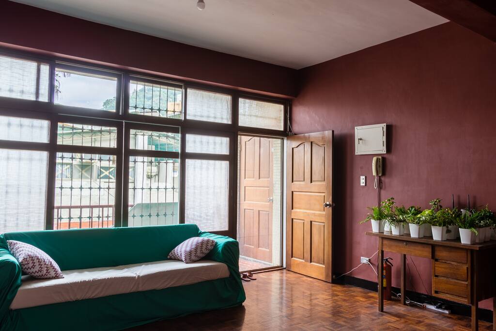 Living room with Co-working studio space shared with art enthusiasts.