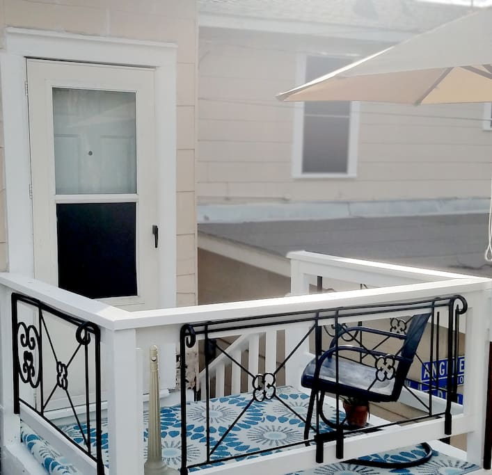 Private patio consists of chair, umbrella and standing ashtray provided.