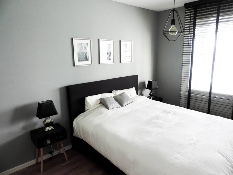 Spacious bedroom with TV.