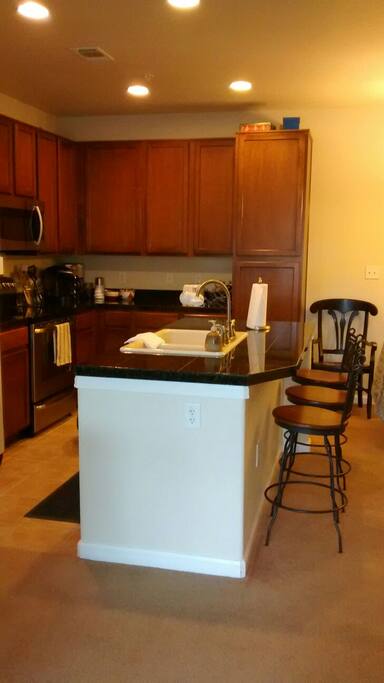 Kitchen with sink and DW island
