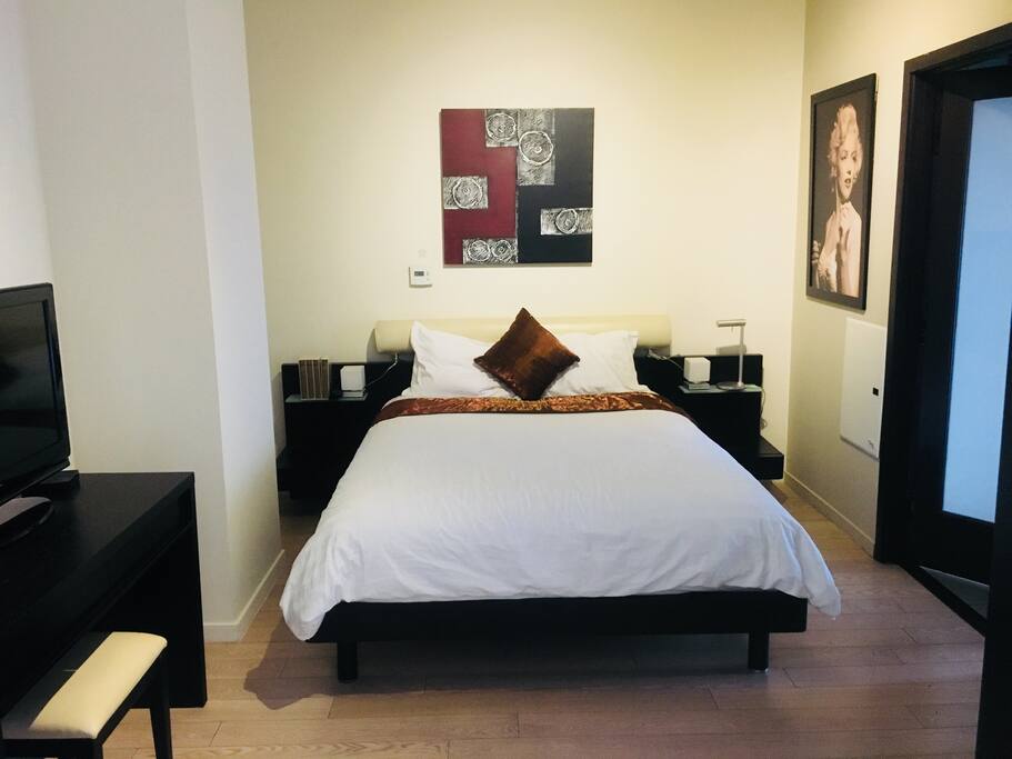Guest bedroom with tv.