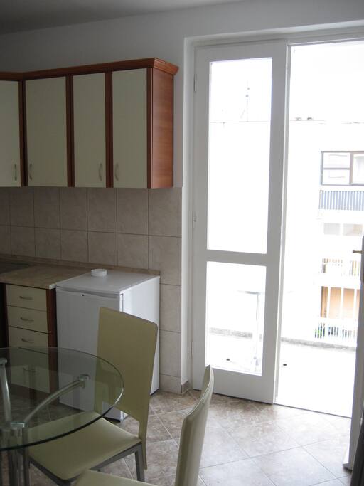 Kitchen with entrance to the balcony