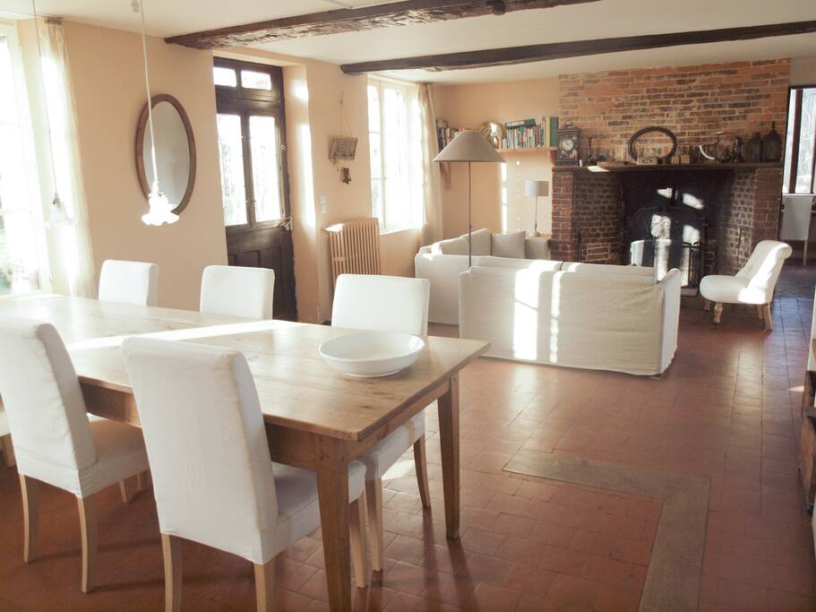 In the spacious kitchen you can gather around the authentic fireplace before having dinner at the large oak dining table.