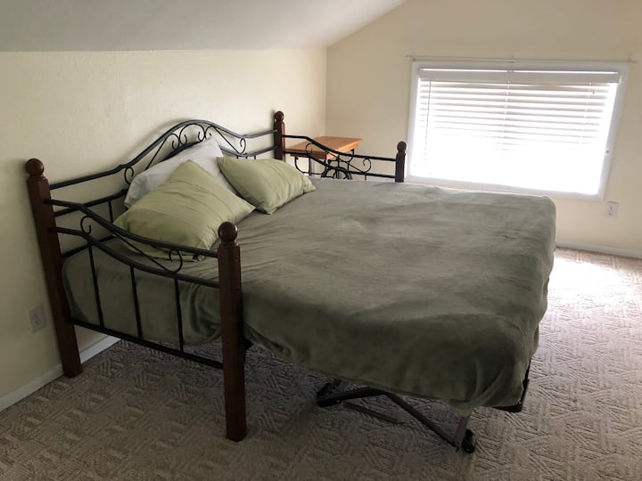 Upstairs you’ll find a day bed made into a king bed. **optional - this room may be set up as two twin beds by request with 48-hour notice.** The flexibility of this room makes it great for couples or the littles with a sleepover atmosphere.