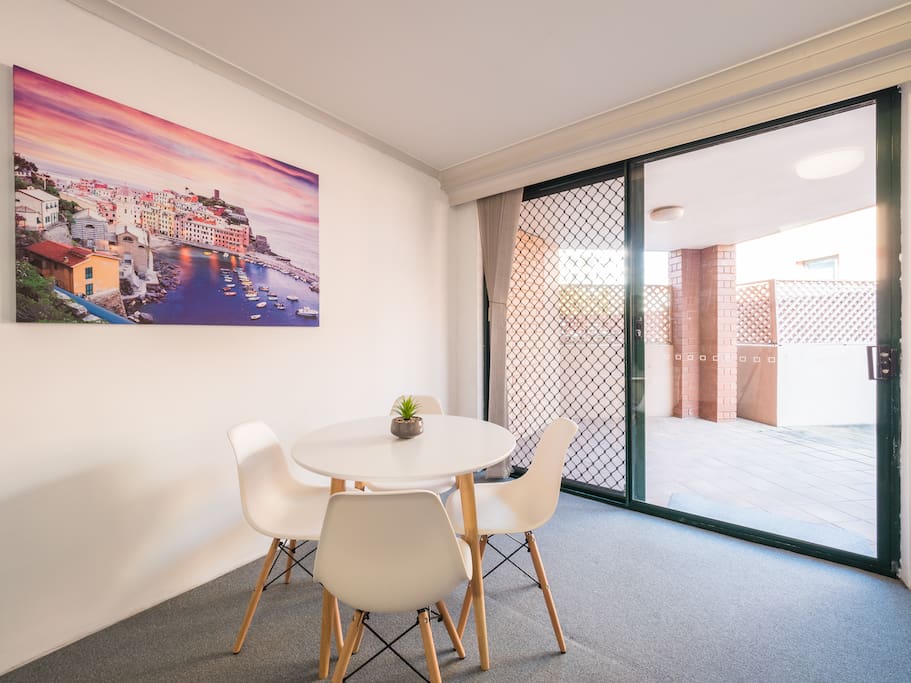 Bright dining area with table for 4 people