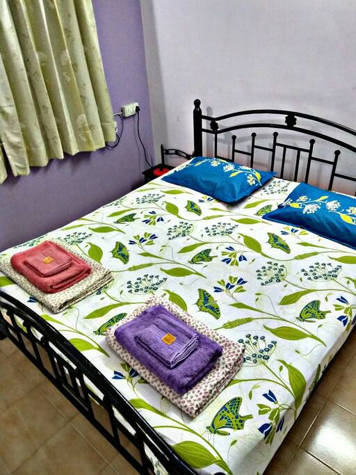 Neatly done bed with fresh linen.