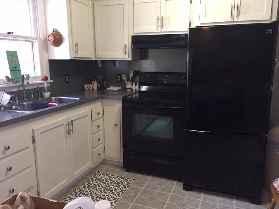 Newly updated kitchen that is fully stocked with everything necessary to cook a meal and enjoy outside or inside dining.