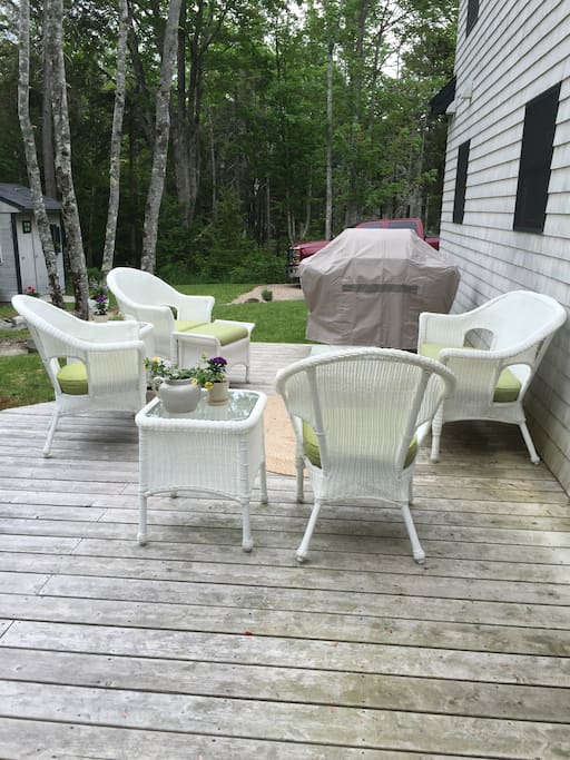 Back Porch with wicker furniture and grill.