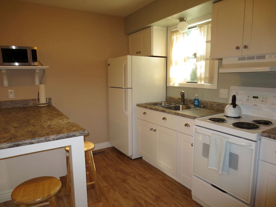 Bright, new, efficient kitchen with everything you need.
