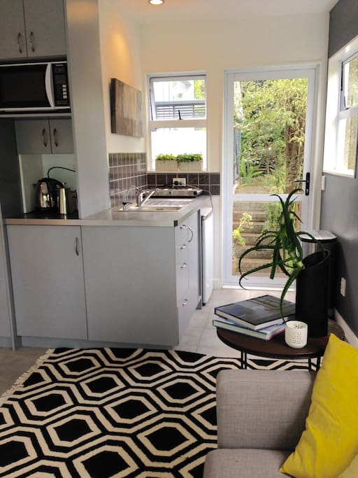 Self contained kitchen area with tea/coffee making facilities, toaster, microwave and elements.