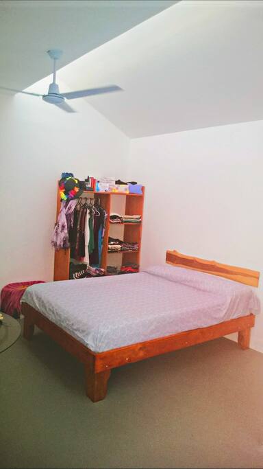 The bed has a comfortable queen size mattress that is perfect for a young couple.