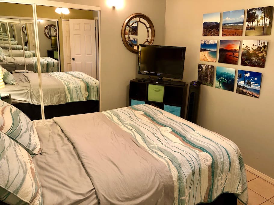 Hawaiian themed bedroom with a metal print collage of photos I took on Maui.