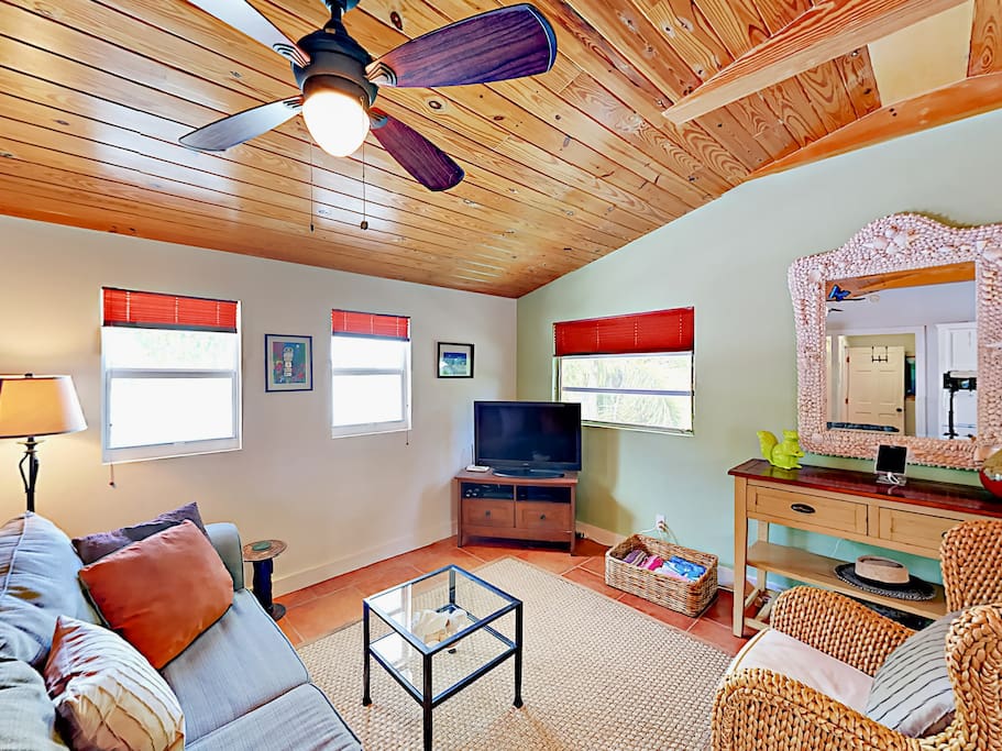 The living room boasts a flat screen TV and cheery furnishings. Complimentary Wi-Fi is provided.