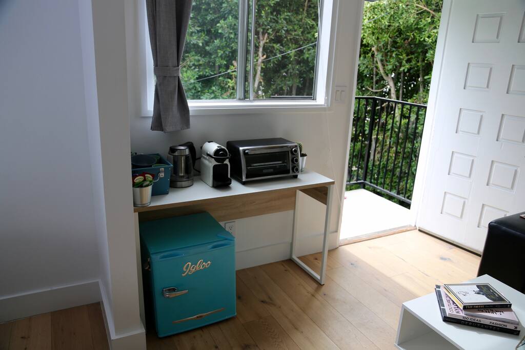 Mini kitchen includes what everyone needs to start a morning, or end a long day equipped with a Nespresso machine (+capsules), tea and complimentary goodies upon check in. Super cute mini refrigerator that adds some vintage vibes to the modern space.