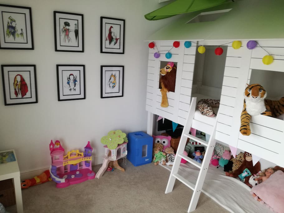 Bedroom 1: treehouse bed with den below. The den has a PS3 for the kids to escape from the parents. The room has lots of toys to play with and a mini fridge for drinks, sweets and fruit.
