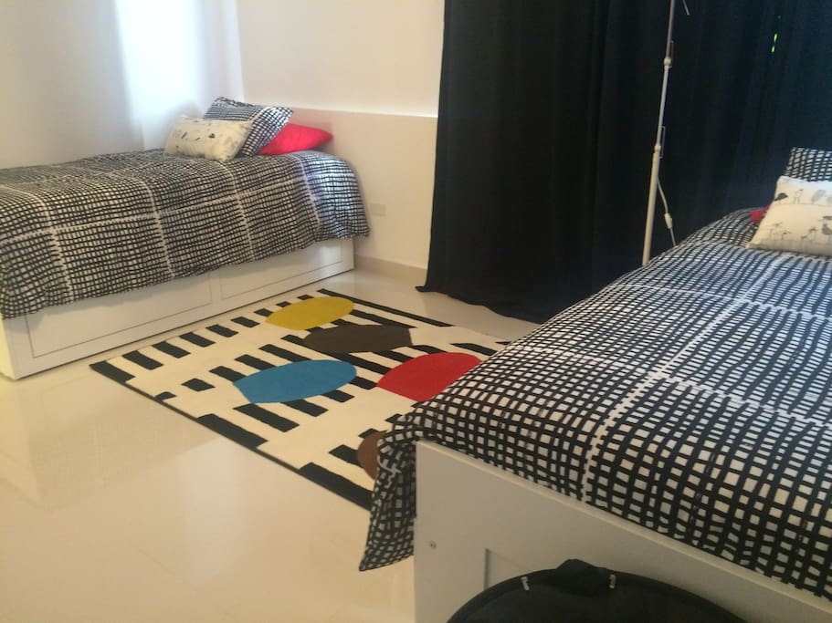Spacious two bedroom with additional sleeping space below each bed.
