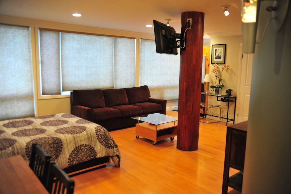 The entire outside wall is covered in windows. When the blinds are opened, the room is filled with light and an amazing view.