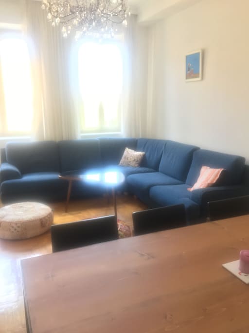 2nd living room with dining table and large sofa