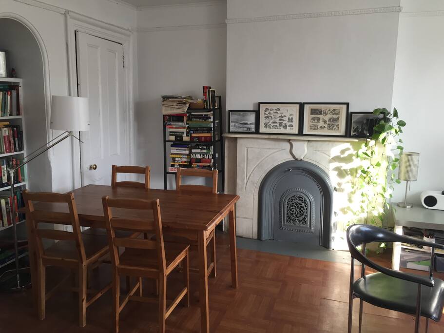 Other side of living area including dining table.