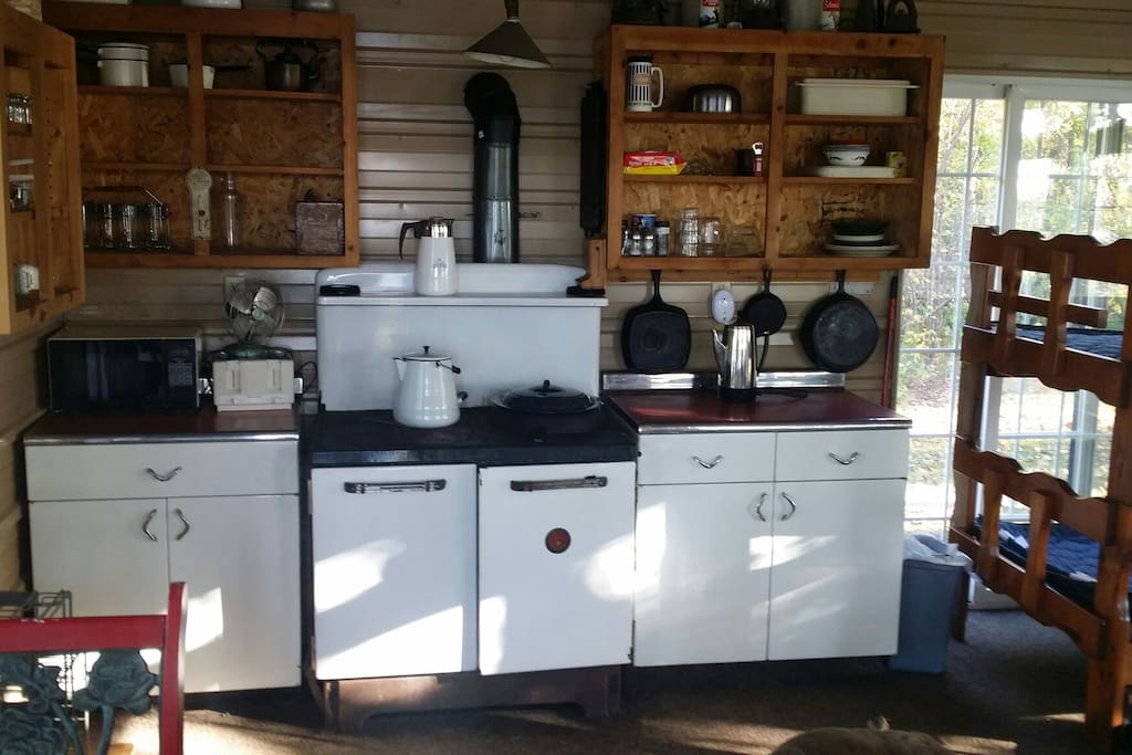 Wood cook stove in One room cabin.