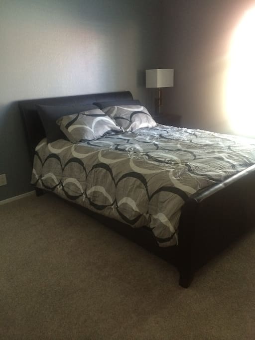 Master Bedroom with Dresser, End Table, Walk-in Closet and a 32" Flat Screen TV