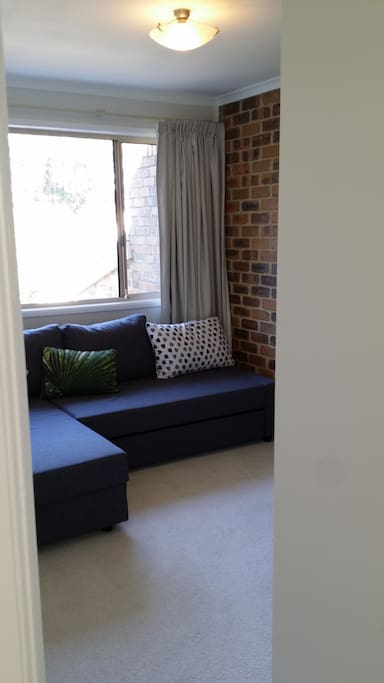 The sofa bed is easily retracted for sitting space during the day.