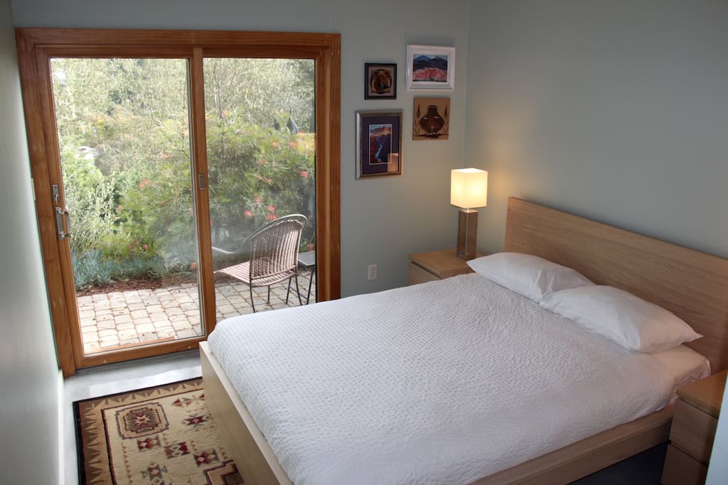 Very comfortable queen sized bed. Step out to private patio.