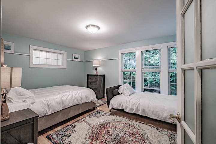 The bedroom off the living room has a queen bed and a day bed.
