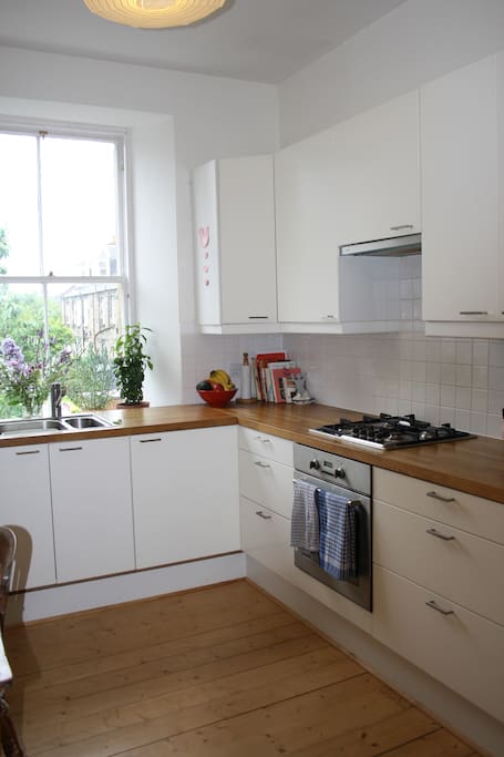 Bright kitchen/dining room overlooking gardens