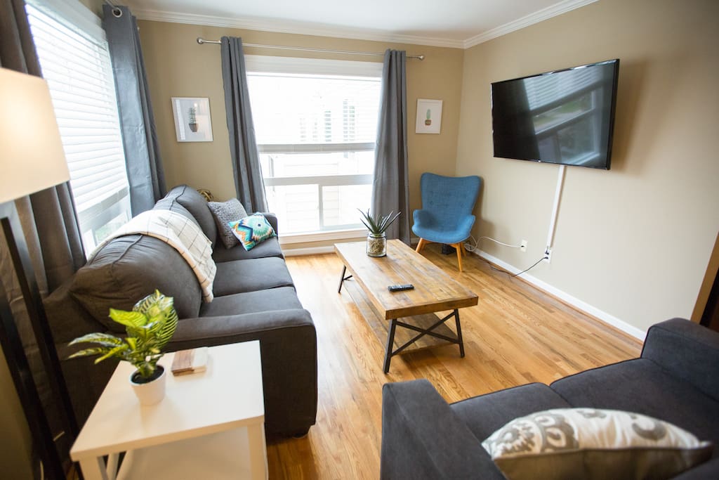 After a great night out, relax in our stylish, comfy living room! Complete with pull-out sofas (couch pulls-out into a queen, loveseat pulls out into a twin) and a 55" Smart TV.