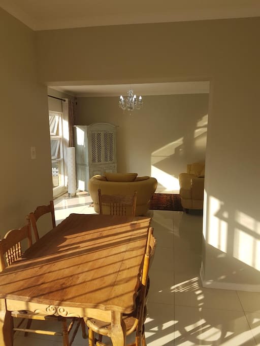 Bright Dinning area with separate kitchen, full fridge, microwave and necessary Kitchen utensils and equipment.