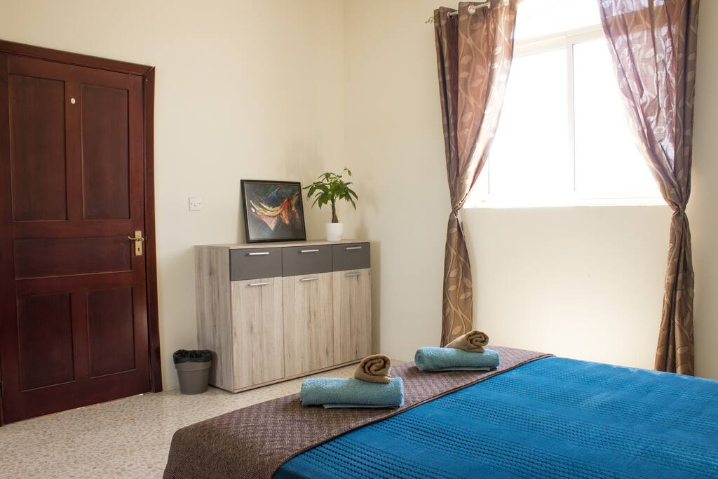 Bedroom with luxurious King-Sized Bed (160cm width) and Countryside View. Towels are provided.