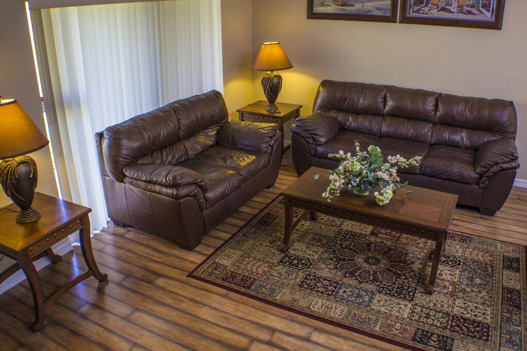 The Living Room,With a 50"TV and Patio Doors.