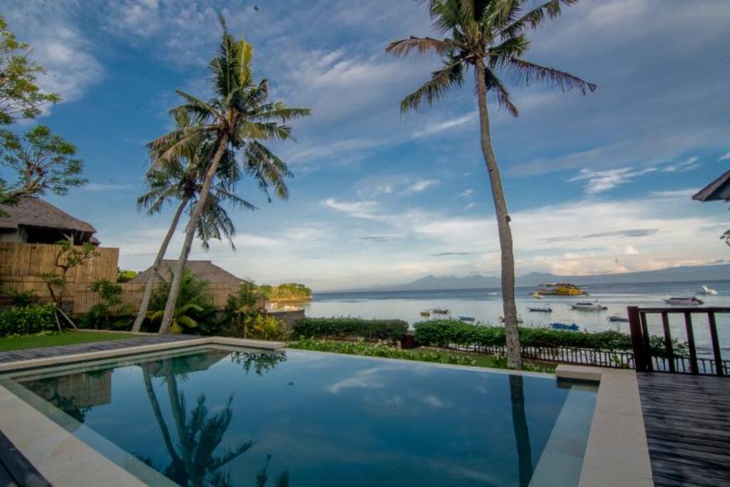 View across pool to ocean and Bali in the distance