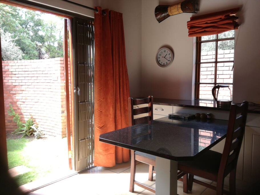 North-facing lounge/dining room with french doors