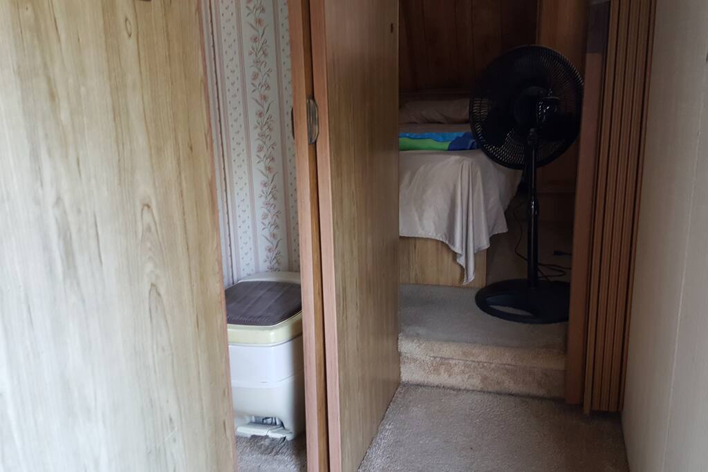 Entrance view to bathroom on the left and bedroom on the right