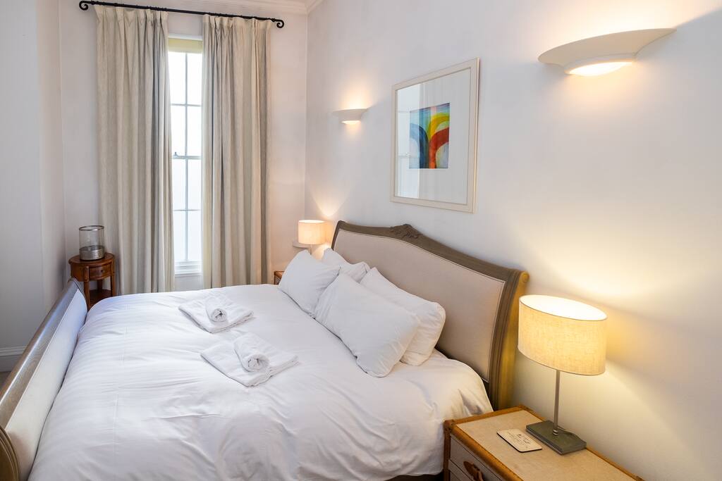 Bedroom 2 also has a king size bed made up with fresh white linen