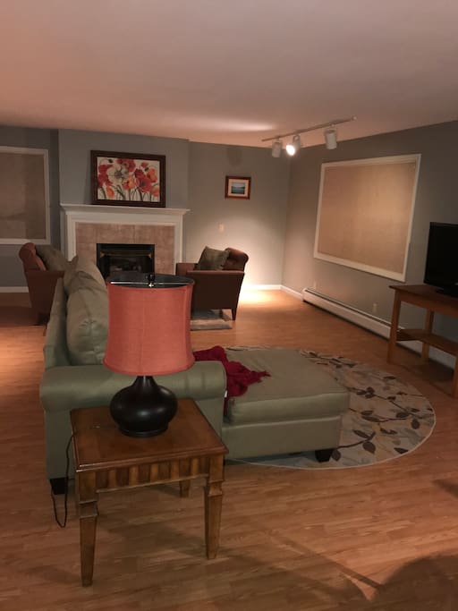 Large living room area with gas fireplace.