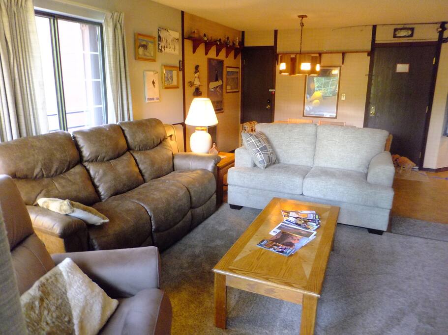 Living room seating for 6-8 with 3 seats that recline.