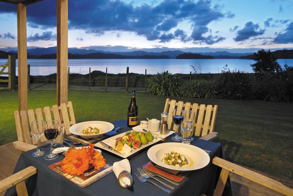 Alfresco dining with sunset view across the harbour.