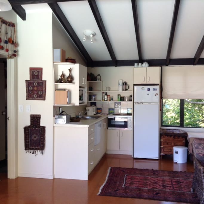 Small kitchen area for self catering, small cooker, microwave, fridge/freezer and dishwasher