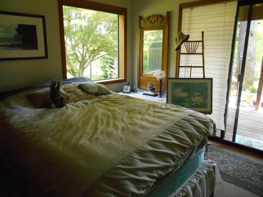 Comfy queen bed with slider to private deck. Private access to your room.
