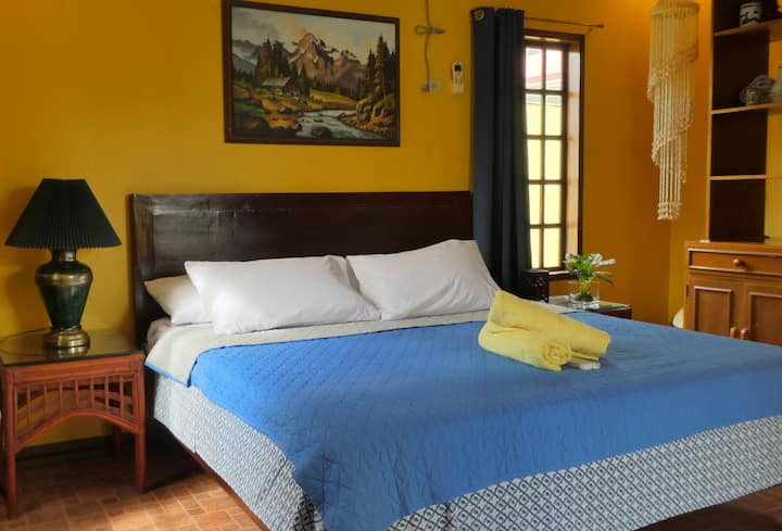 Bedroom A - King Sized Bed.
Pool view room. Has a TV and mini Refrigerator.

Pls take note that this room does not have an attached toilet and bath but is located a few steps away from the room. 
