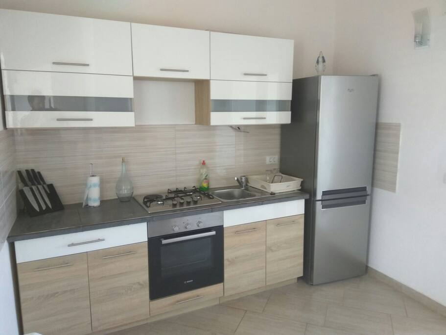 Small kitchen with an electric kettle and microwave out of shot