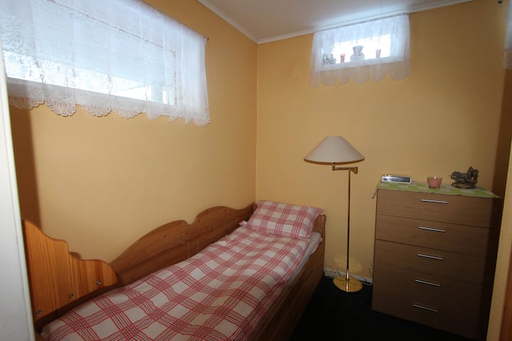 A small bedroom with single bed